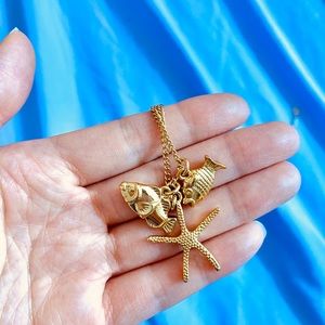 J Crew gold necklace with starfish charms